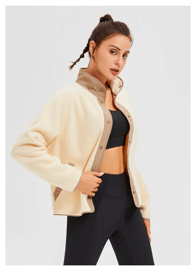 Woman wearing Stylish Wool Sports Jacket SF2009 for running, featuring a windproof design and mandarin collar, perfect for winter workouts.